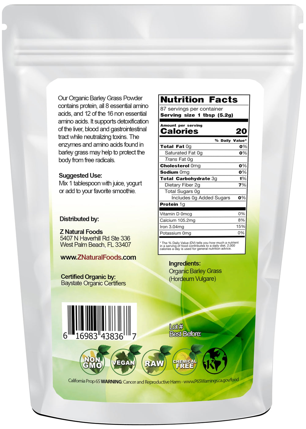 Scoop of barley grass powder on a white surface