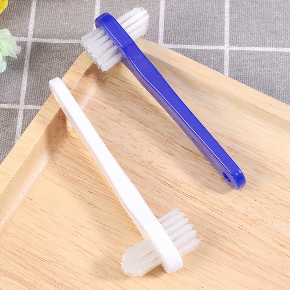 Close-up of dual brush heads for dentures