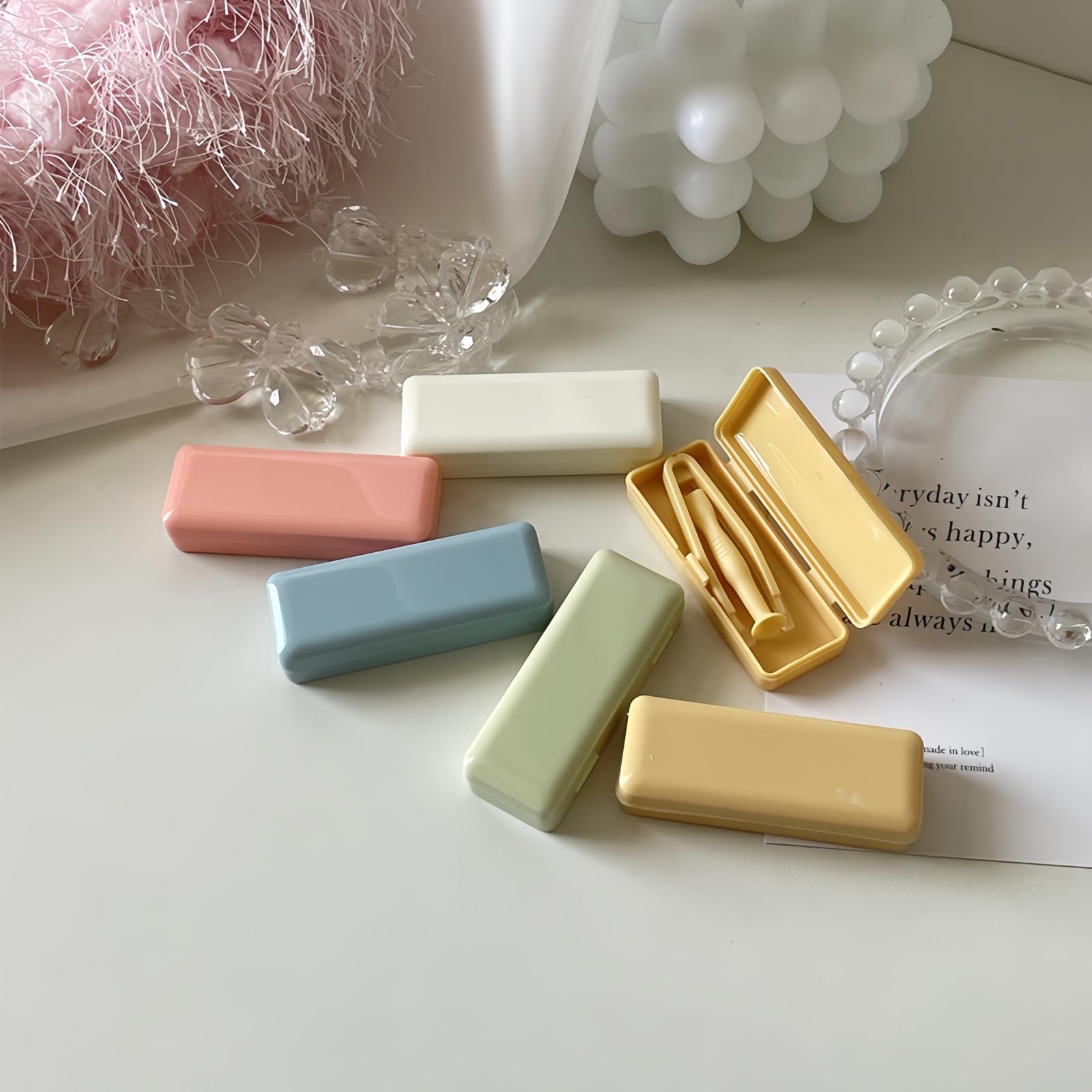 Close-up of soft-tip silicone tweezer and inserter in the Bedartist kit