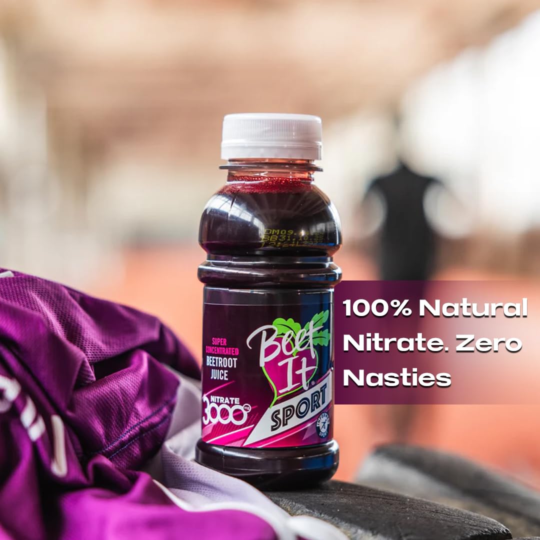 Athletic person preparing a workout with Beet IT bottle