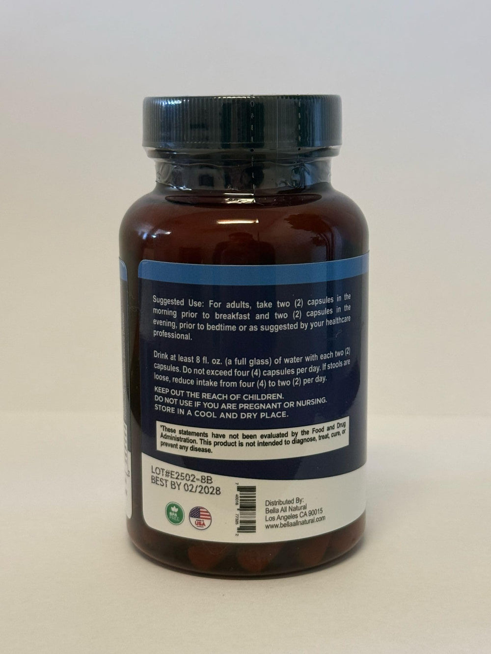 Bella All Natural Extreme Detox capsules closeup showing 60-count bottle for toxin elimination routine.