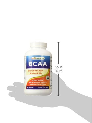 Instantized BCAA powder scoop beside bottle
