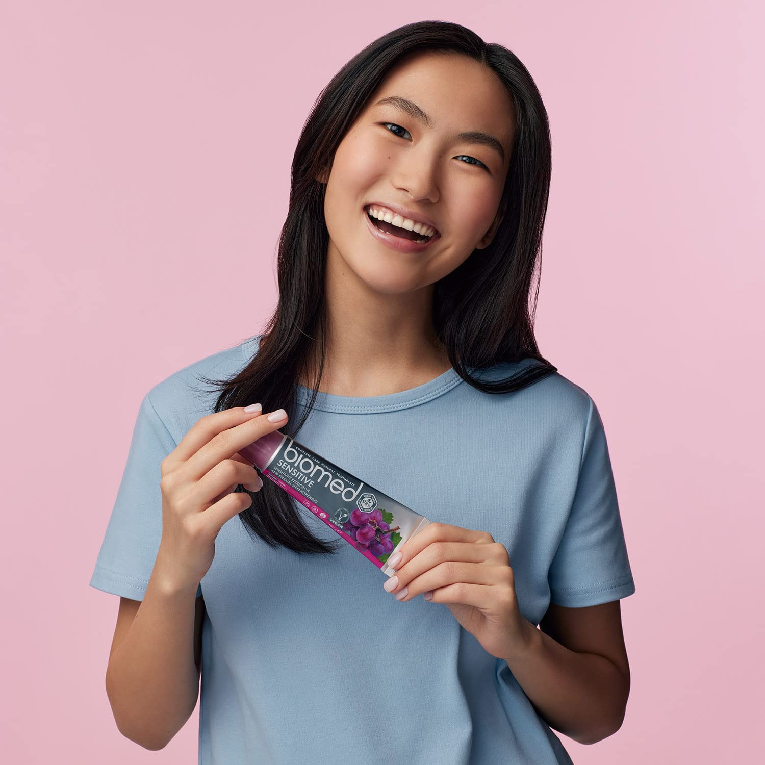 Biomed toothpaste with packaging on a clean surface