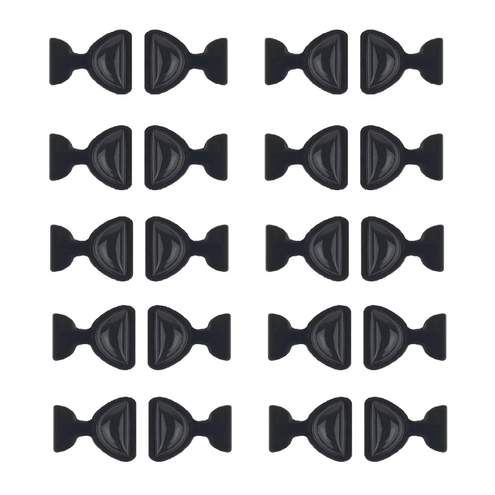 Close-up of black butterfly adhesive silicone eyeglass nose pads