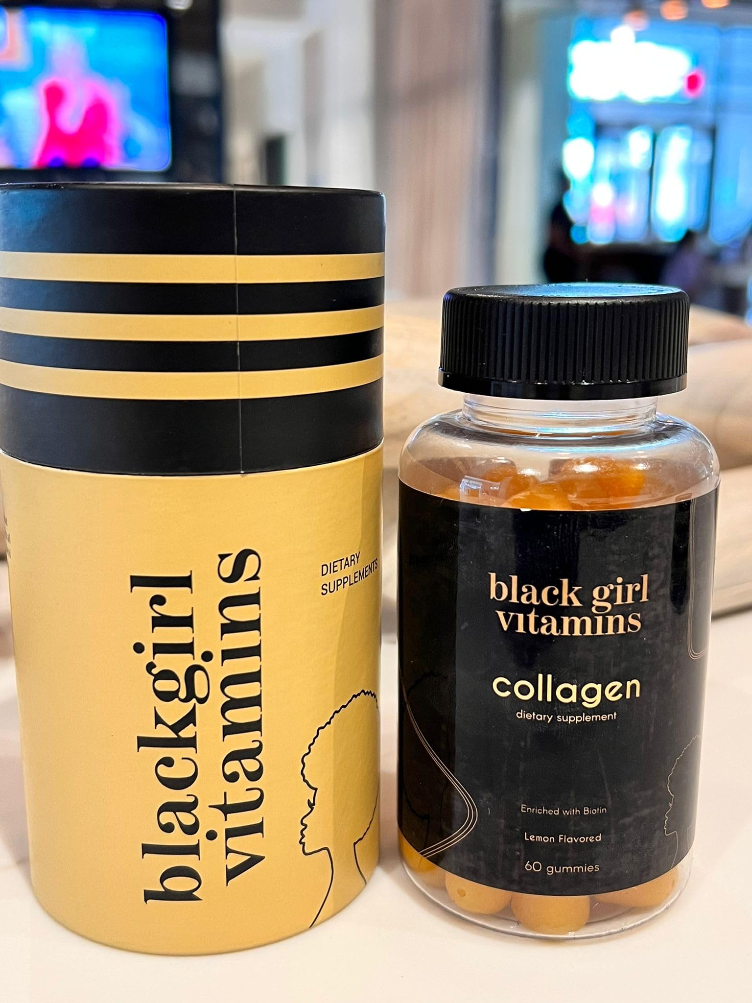 Lifestyle image of a hand reaching for the bottle on a clean surface