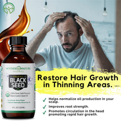 Close-up of cold-pressed black seed oil extraction