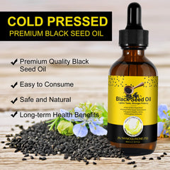 Glass bottle of black seed oil showing golden color