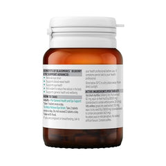 Bottle with tablets spilled next to information card