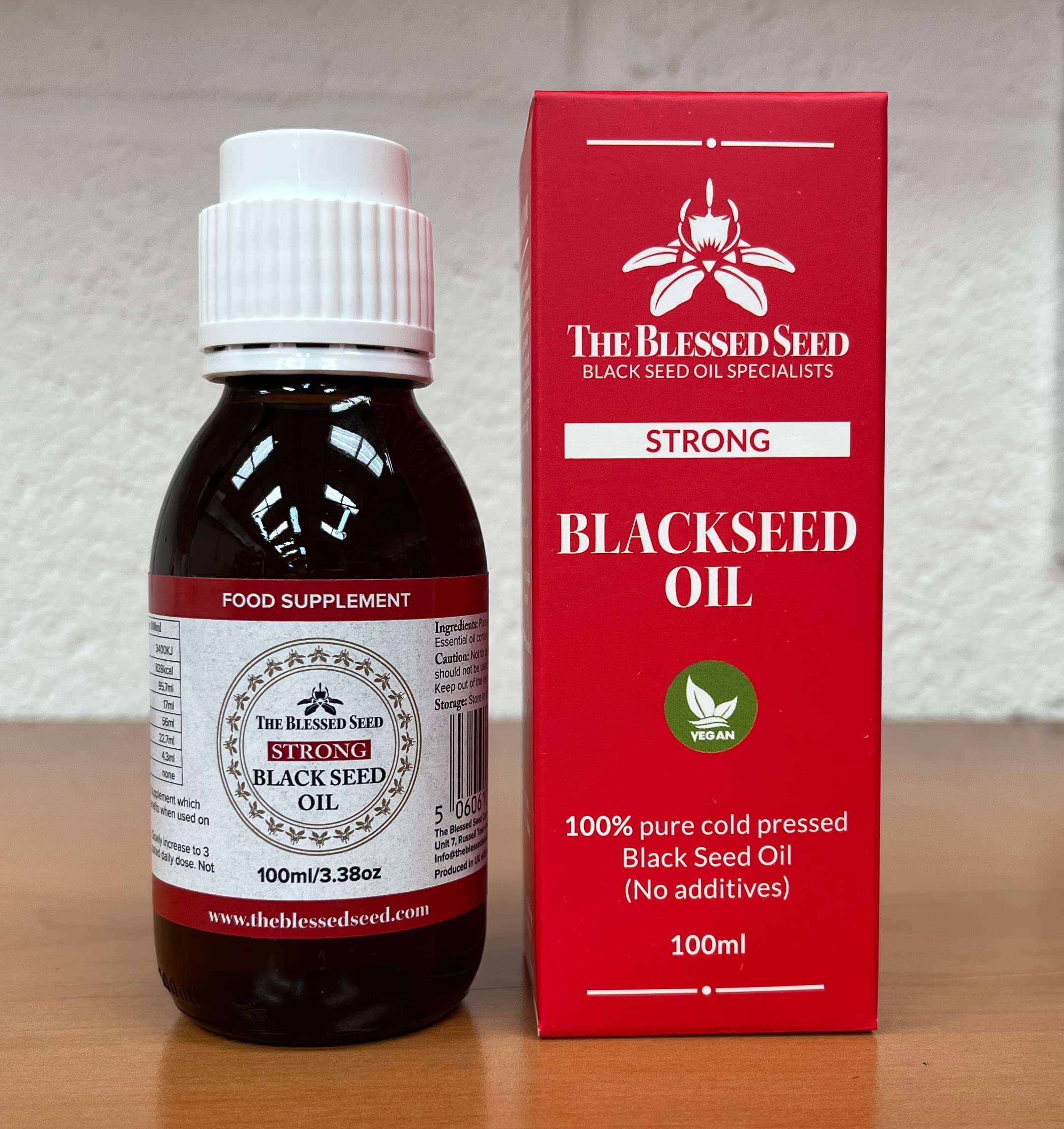 Amber bottle with no-drip spout for The Blessed Seed Black Seed Oil