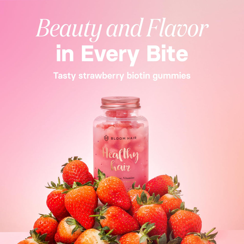 Woman holding Bloom Hair Gummies bottle for hair growth