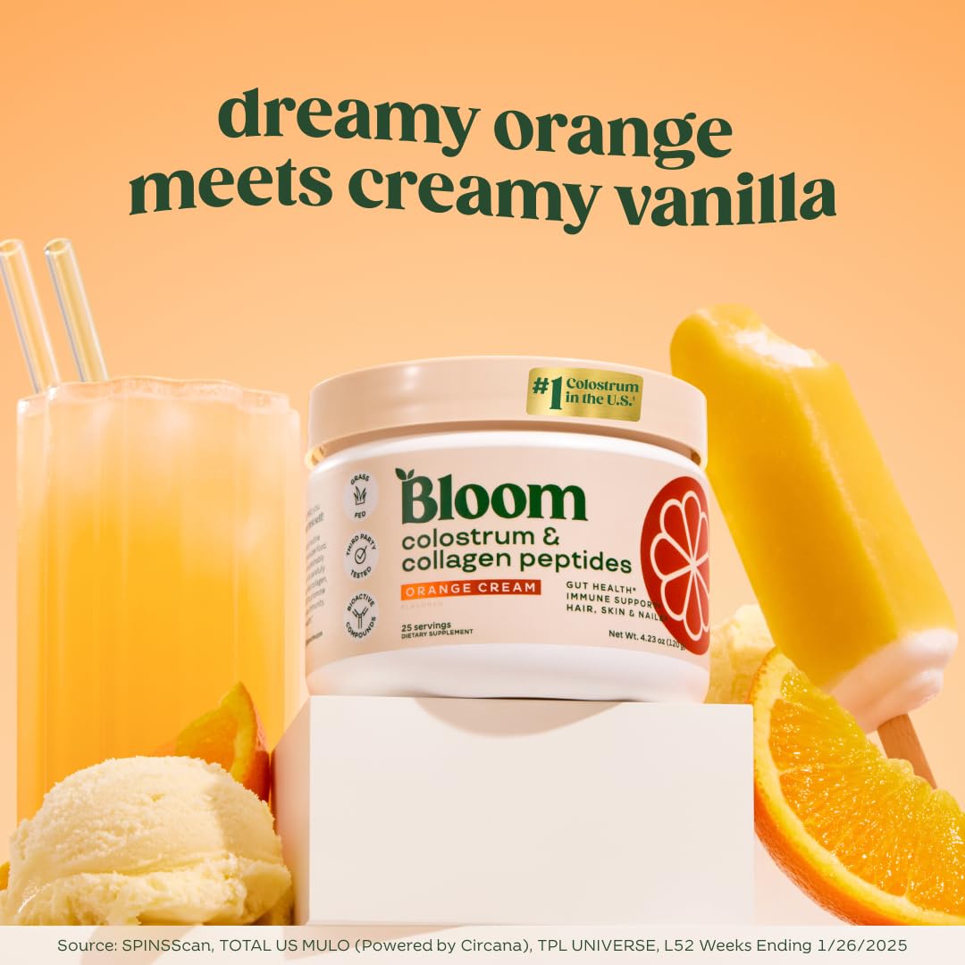 Scoop of Bloom Nutrition Colostrum powder with glass of water