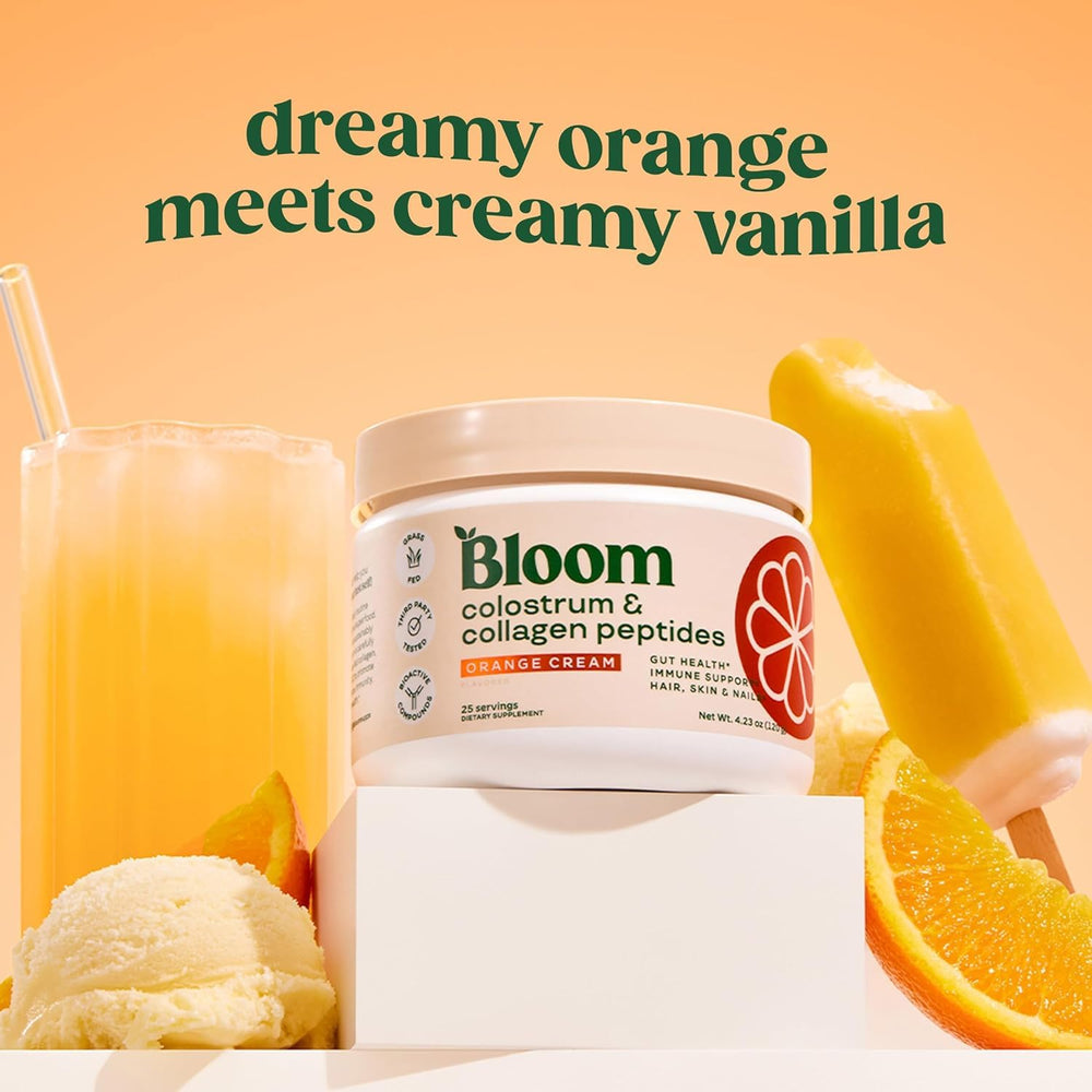 Close-up of Bloom Nutrition Colostrum powder bottle with Orange Cream flavor