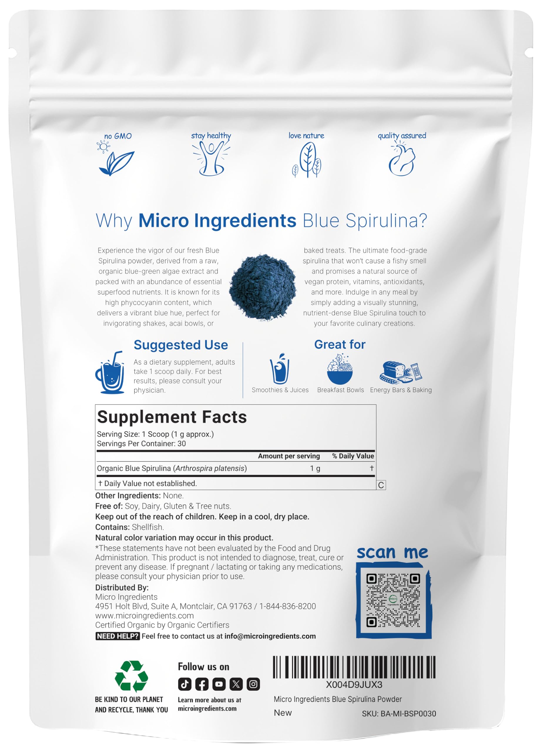 Blue spirulina powder being scooped with a scoop