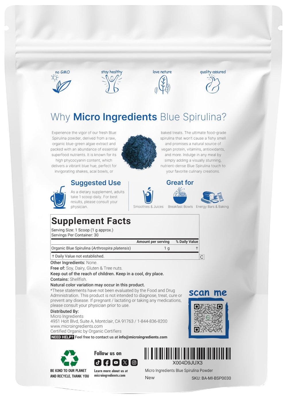Blue spirulina powder being scooped with a scoop