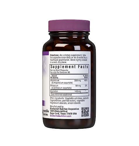 Capsules spilled from bottle with packaging in background