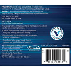 Athlete performing workout with supplement jar nearby