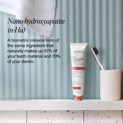 Toothpaste being squeezed onto a toothbrush with Cinnamon Mint flavor