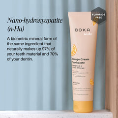 Kids-friendly toothpaste packaging with orange cream flavor