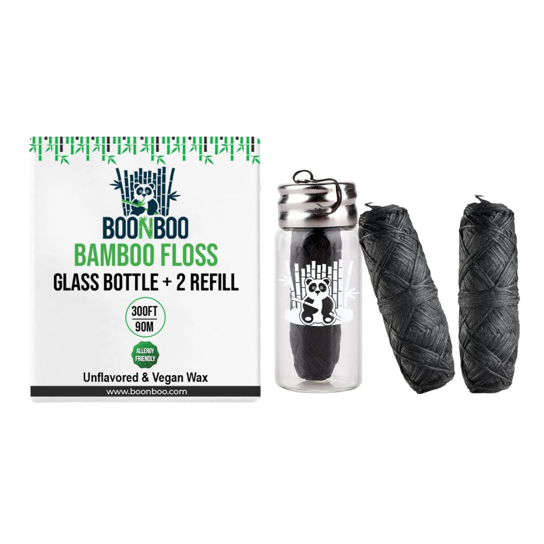 Charcoal woven dental floss in glass bottle with 2 refill heads
