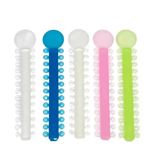 Glow-in-the-dark braces ties display showing luminous colors