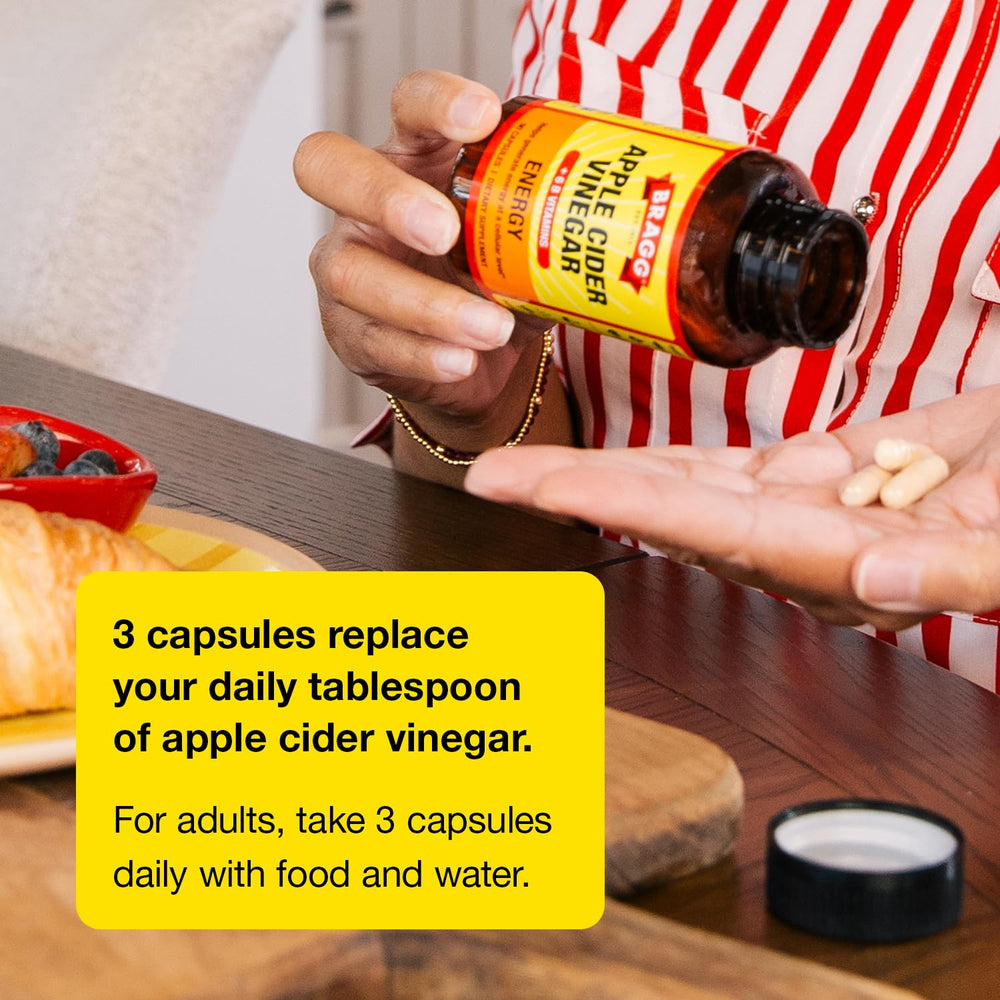 Bragg bottle beside apples to show product scale and natural focus