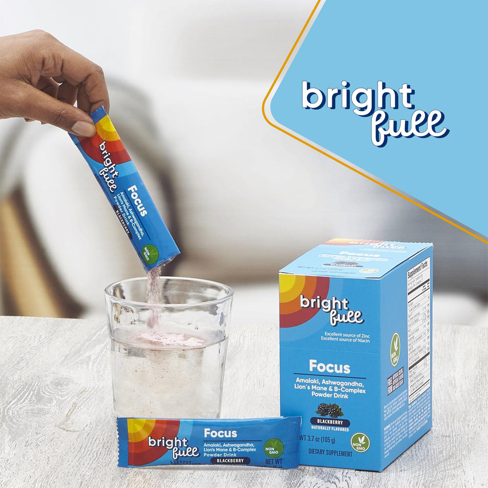 Pouring BRIGHTFULL Focus into water with blackberry flavor