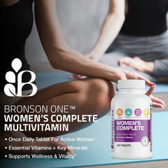Active woman taking a multivitamin bottle