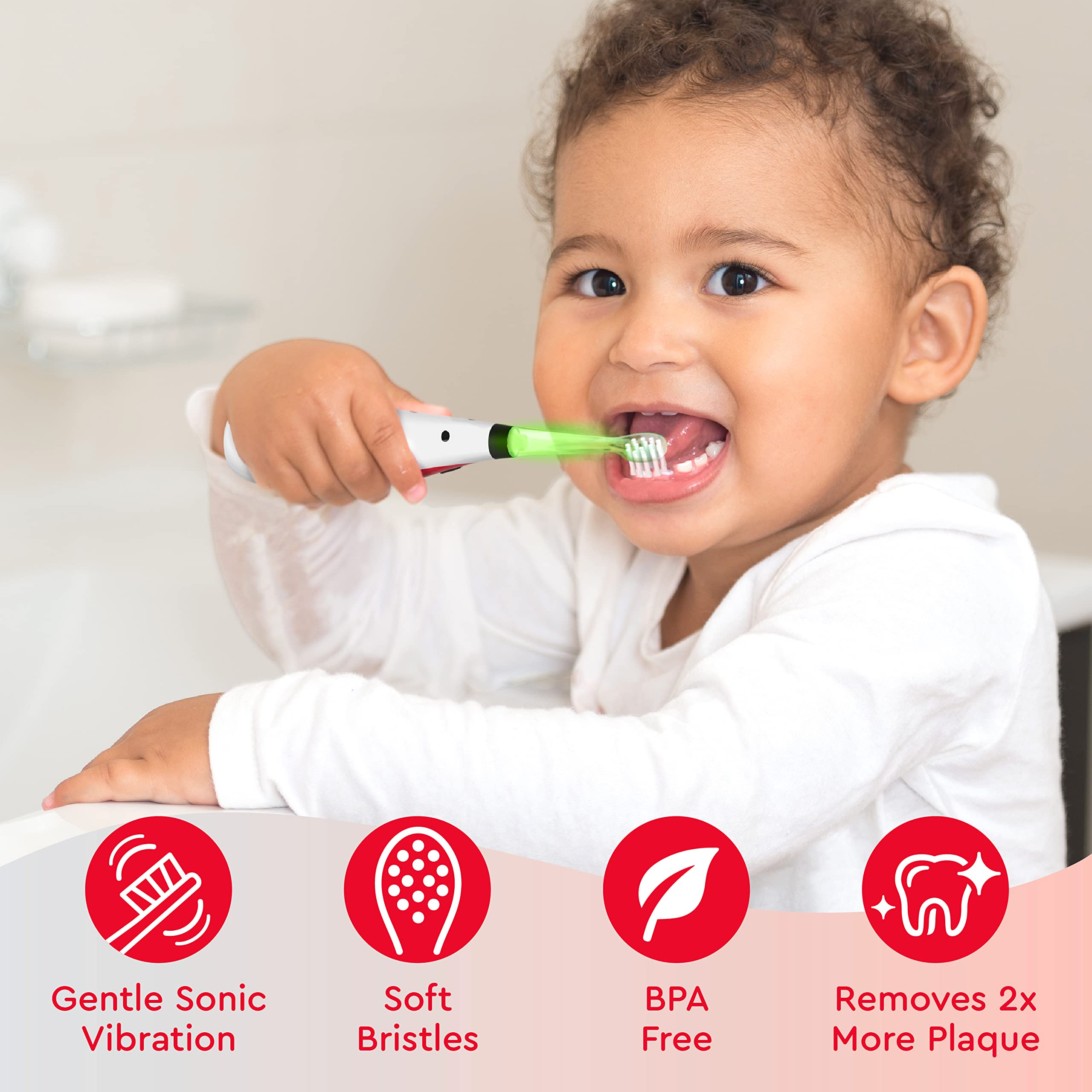 Light-up timer on toothbrush showing green, blue, yellow, and red.