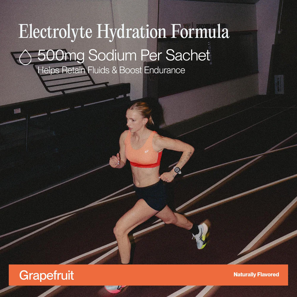 Cadence Race Grapefruit sachet dissolving in water for fast hydration and focus.
