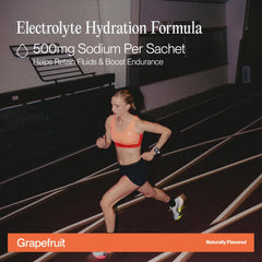 Cadence Race Grapefruit sachet dissolving in water for fast hydration and focus.
