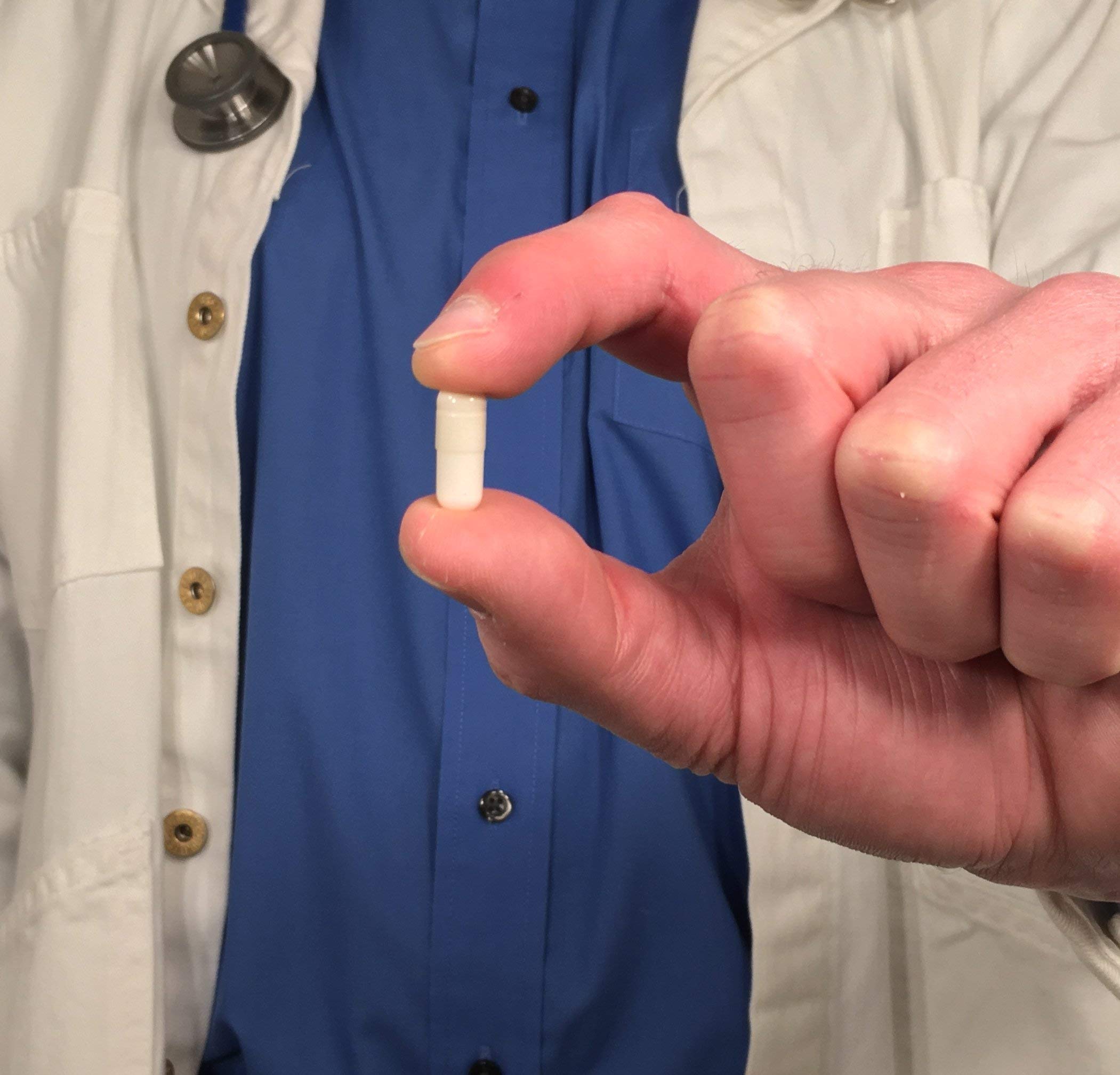 Dosage illustration showing 1-3 capsules per dose