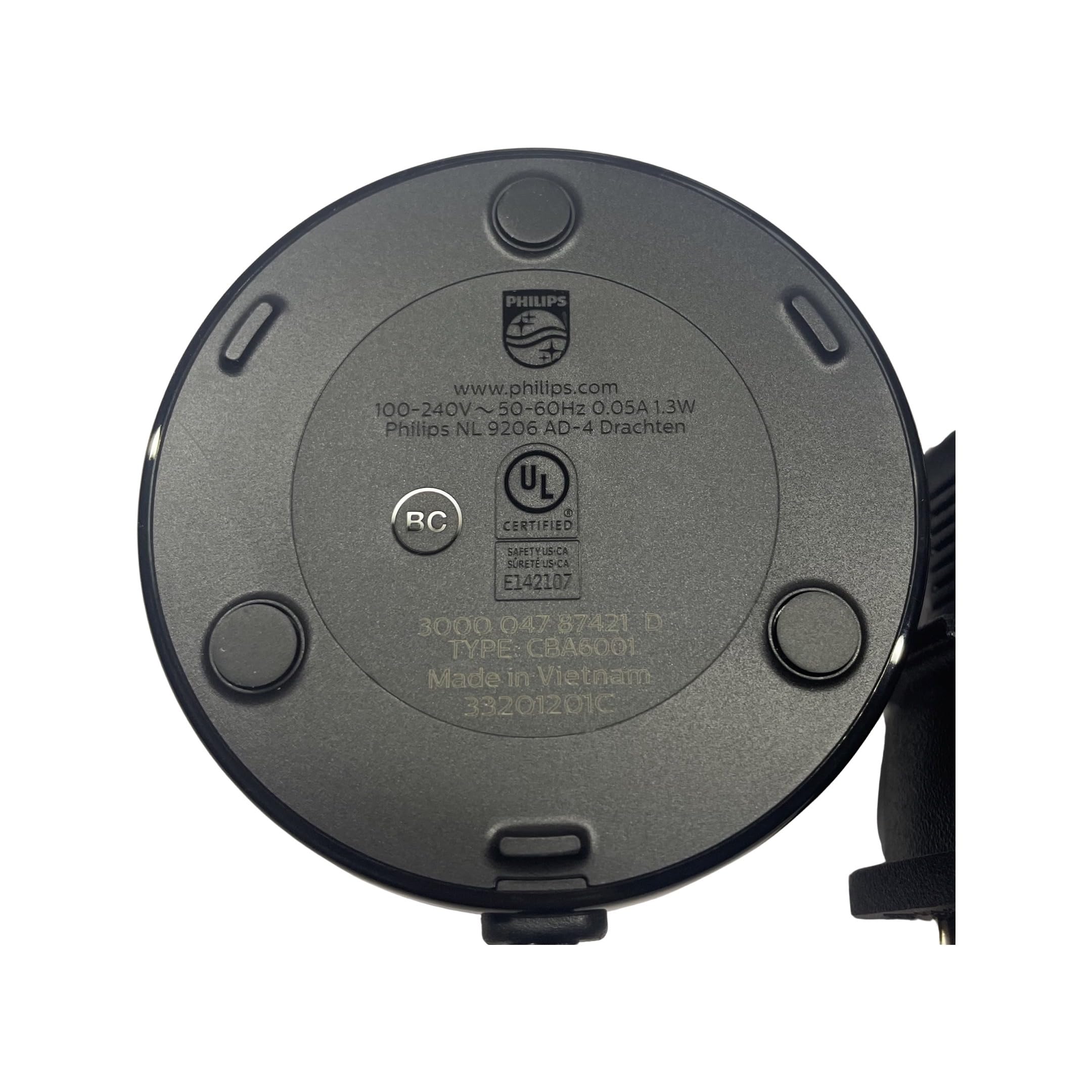 Black CELADON charging base on a white surface with logo