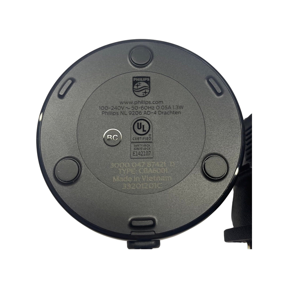 Black CELADON charging base on a white surface with logo