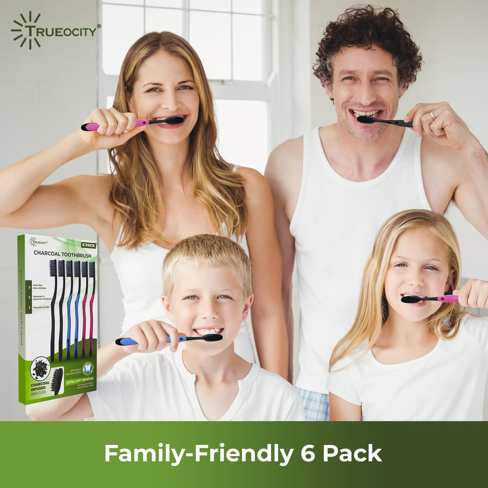 Activated charcoal toothpaste beside toothbrush