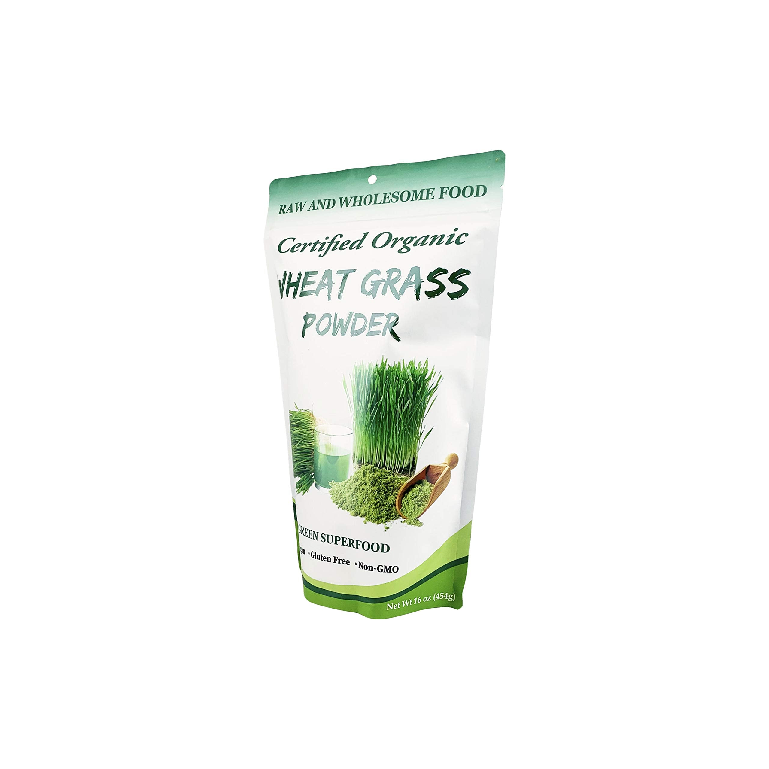 Measuring scoop of organic wheatgrass powder being added to a smoothie