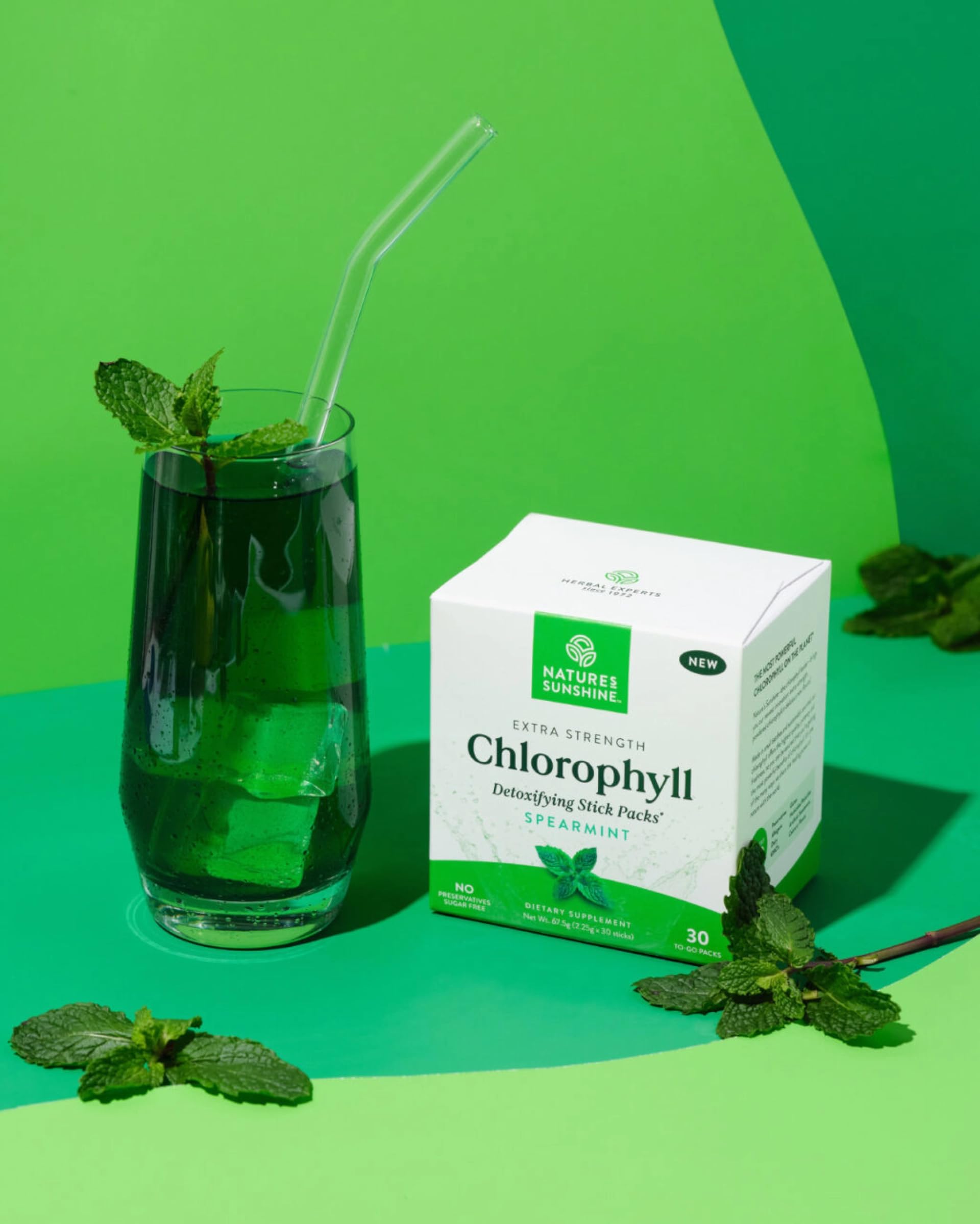 Close-up of chlorophyll powder dissolving in water