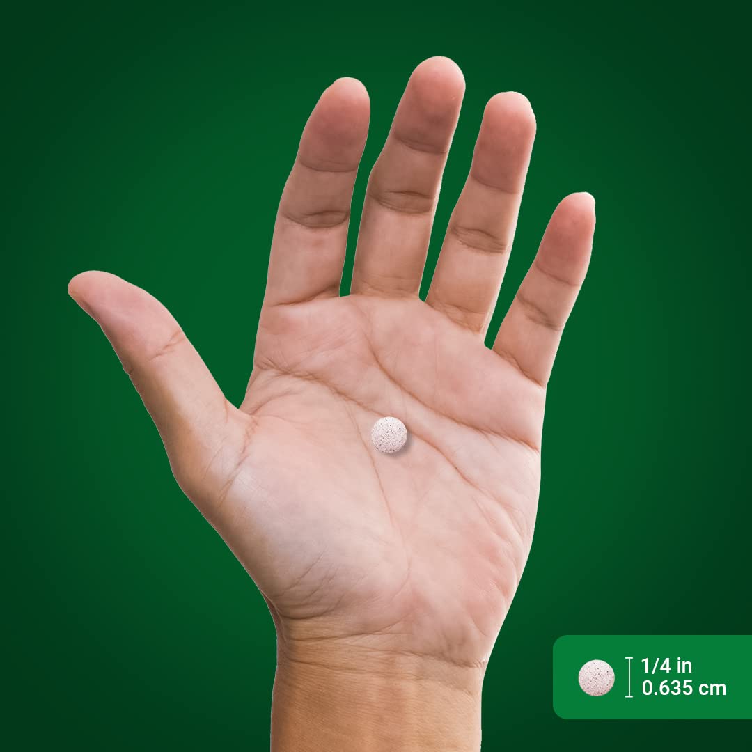 Tablets inside chromium picolinate bottle next to cap