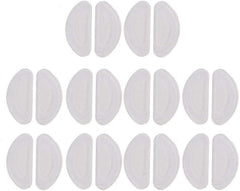 Clear adhesive nose pads attached to eyeglasses frame