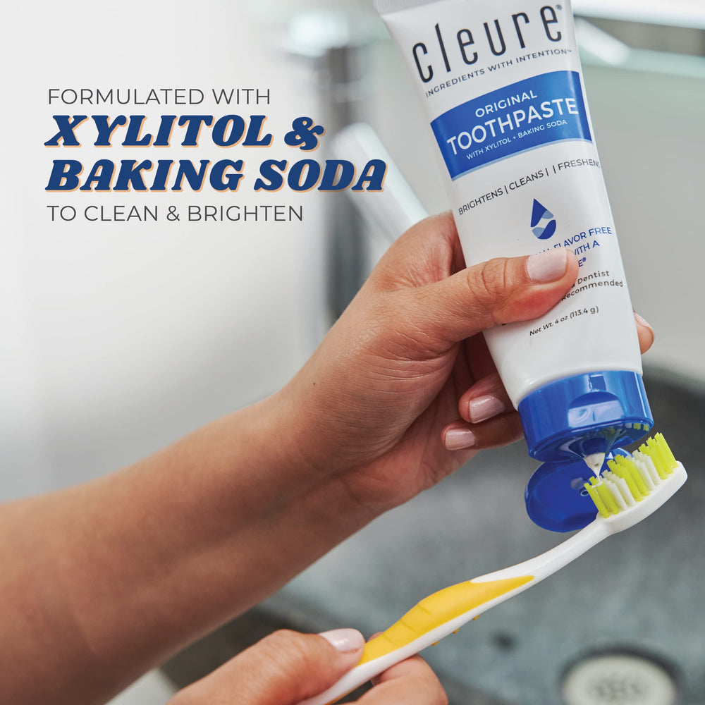 Toothpaste on toothbrush showing gentle, fluoride-free formula