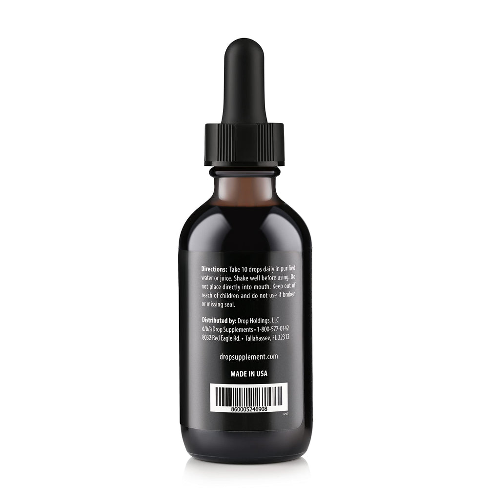 Close-up of dropper releasing fulvic minerals