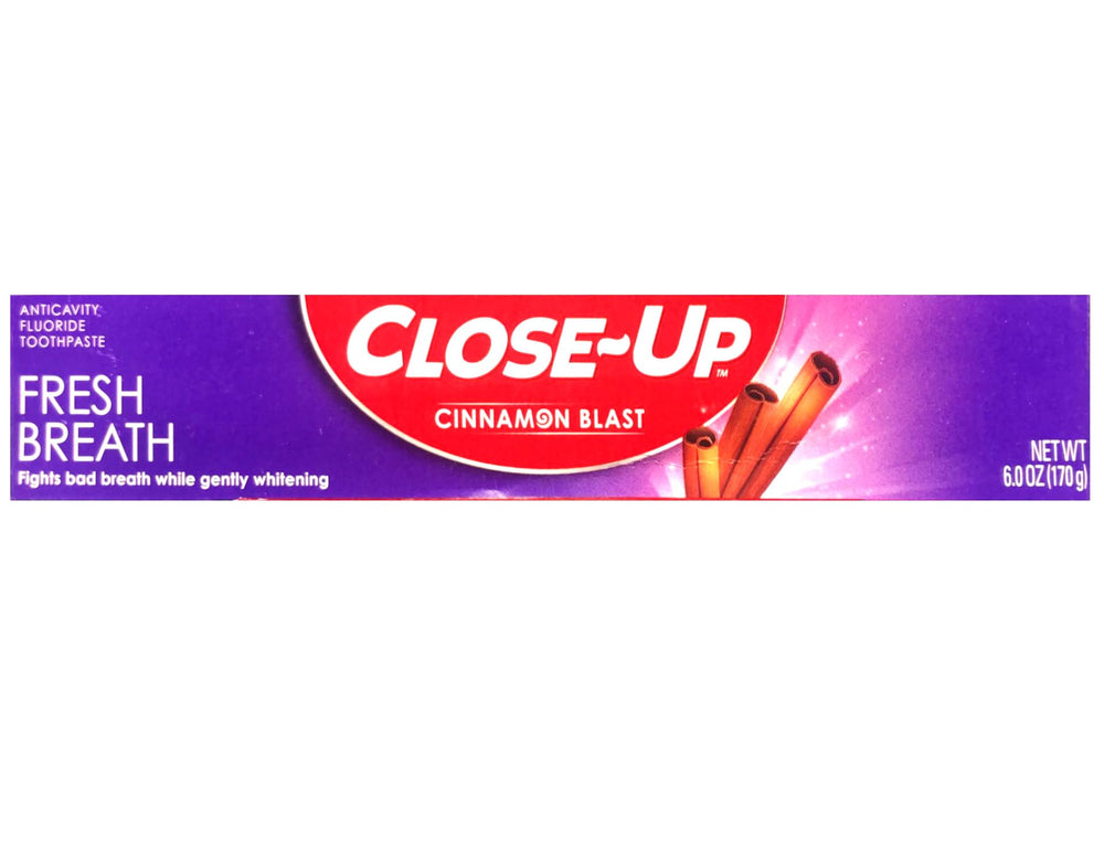 Toothbrush with red gel toothpaste on bristles