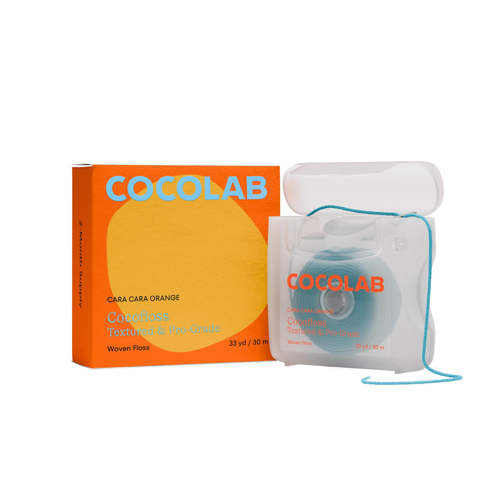 Cocofloss Woven Dental Floss orange scent spool close-up