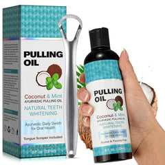 Bottle of coconut oil pulling mouthwash with peppermint and tongue scraper