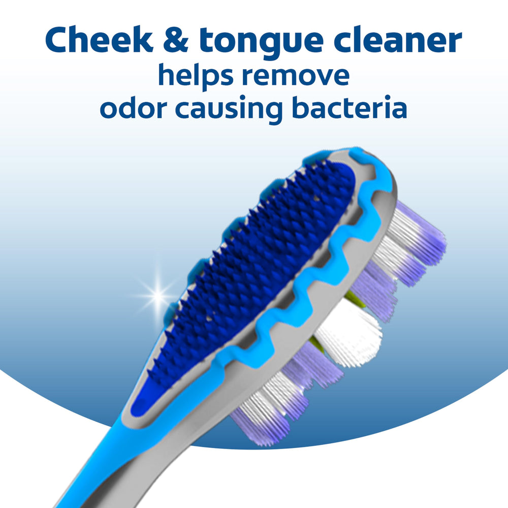 Purple floss-tip bristles reaching between teeth