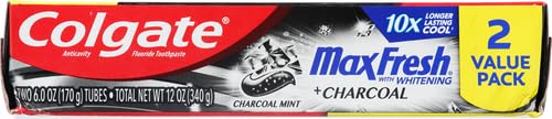 Smiling person after brushing with Colgate Charcoal Mint
