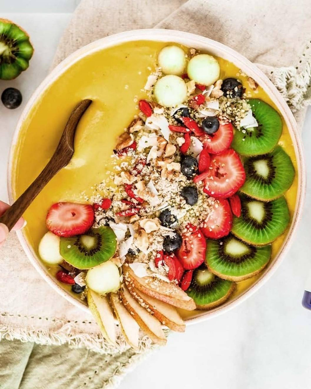 Collagen powder being mixed into a smoothie