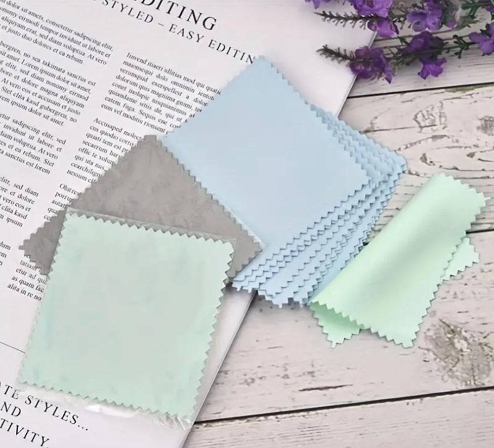 Compact pack of microfiber cloths for cleaning in product display