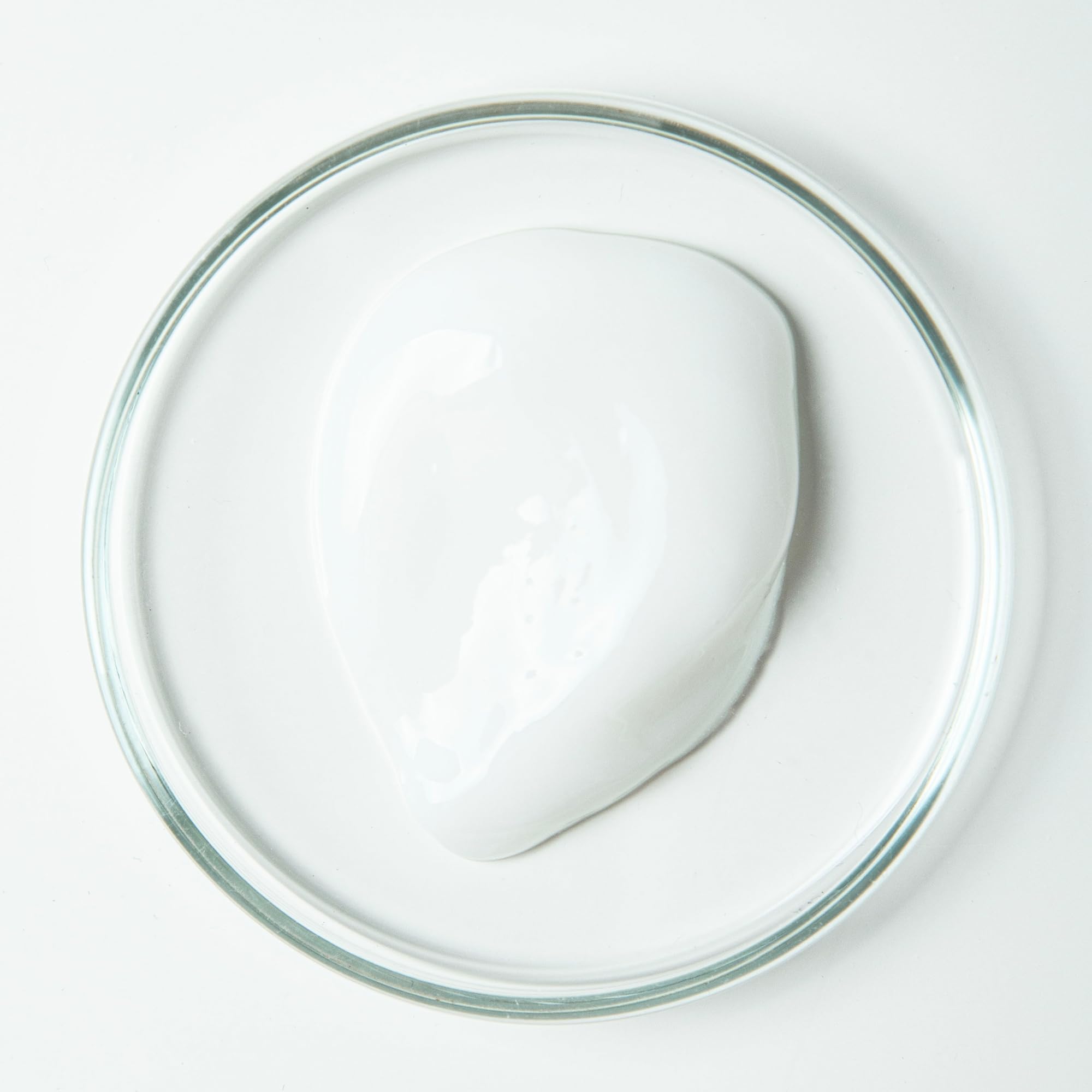 Close-up of toothpaste ingredients: aloe vera, organic peppermint, green tea extract, fluoride