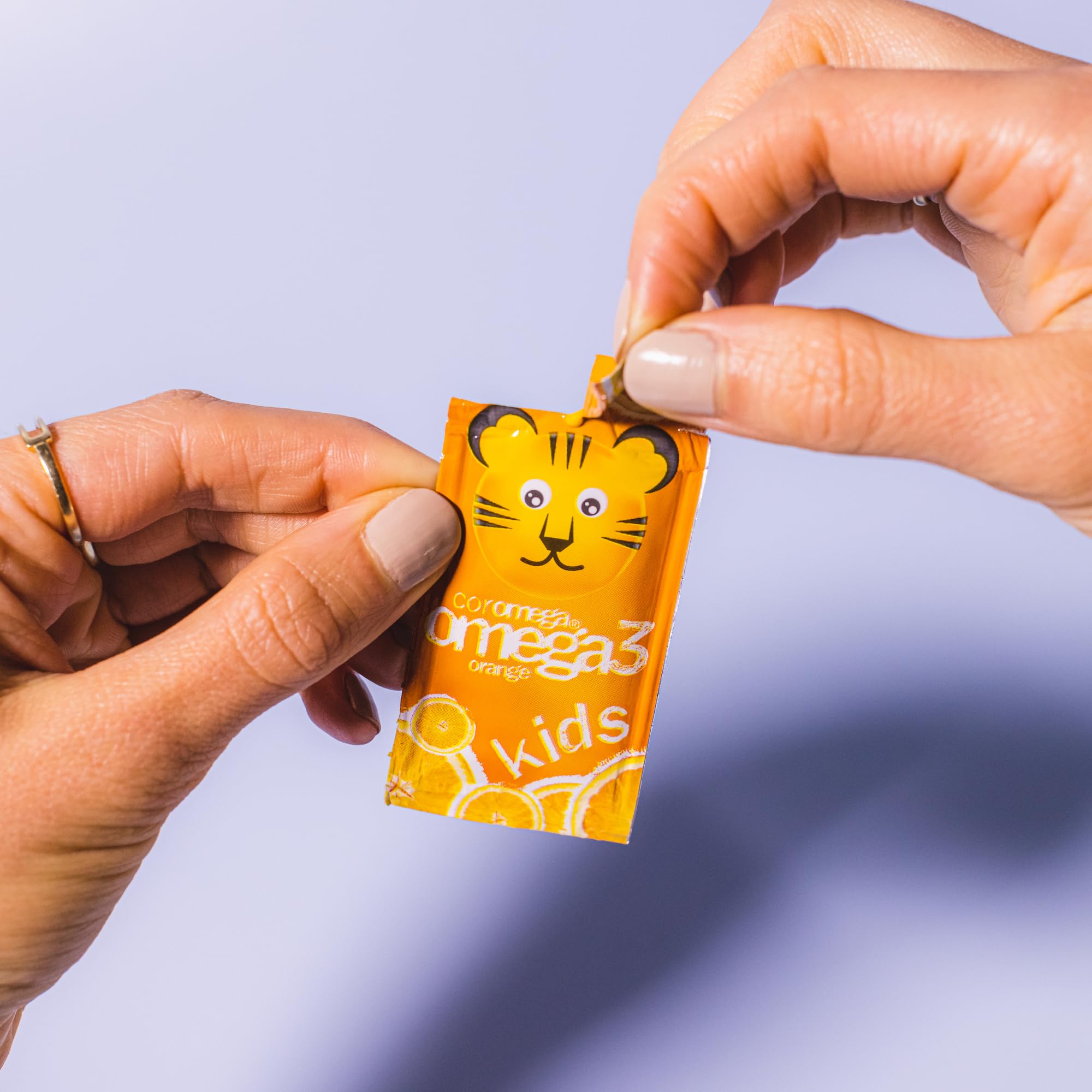 Tropical orange flavor illustration for Coromega Kids Omega-3