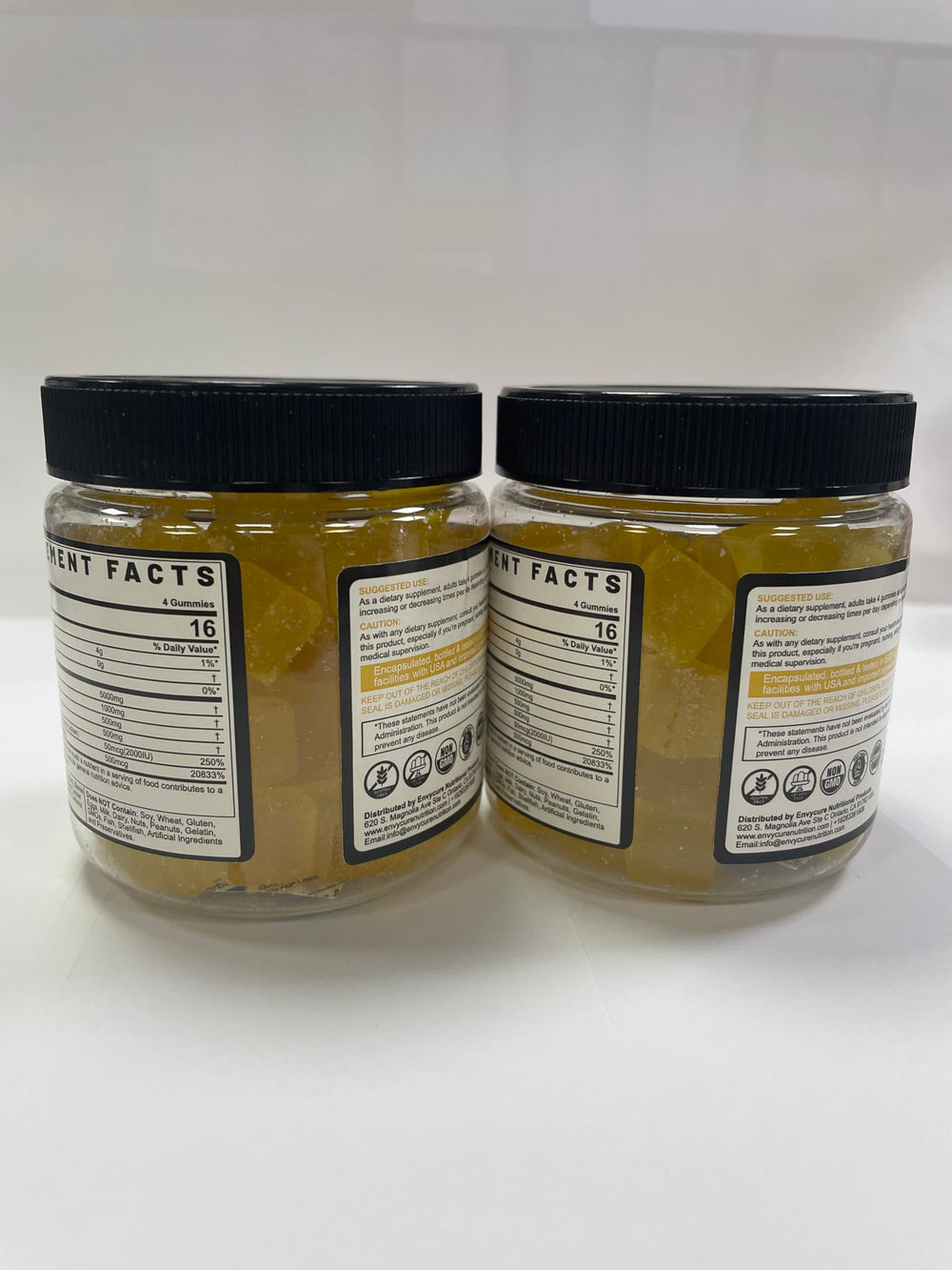 Gummies on white surface with lemon slice